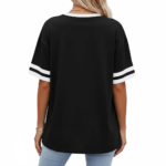 A person wearing a breathable cotton VALE graphic t-shirt with varsity stripes on sleeves, available in black, brown, and orange.