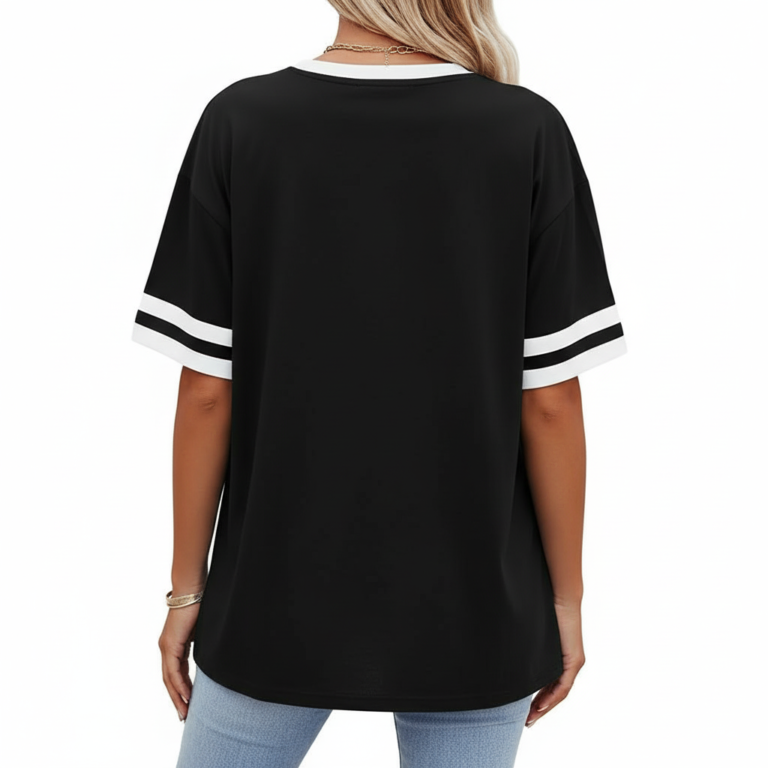 A person wearing a breathable cotton VALE graphic t-shirt with varsity stripes on sleeves, available in black, brown, and orange.