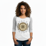 Woman wearing a breathable cotton raglan 3/4 sleeve shirt featuring a vintage nautical compass "VALE" graphic design, available in Grey/Black, White/Grey, and Olive/Black colorways.