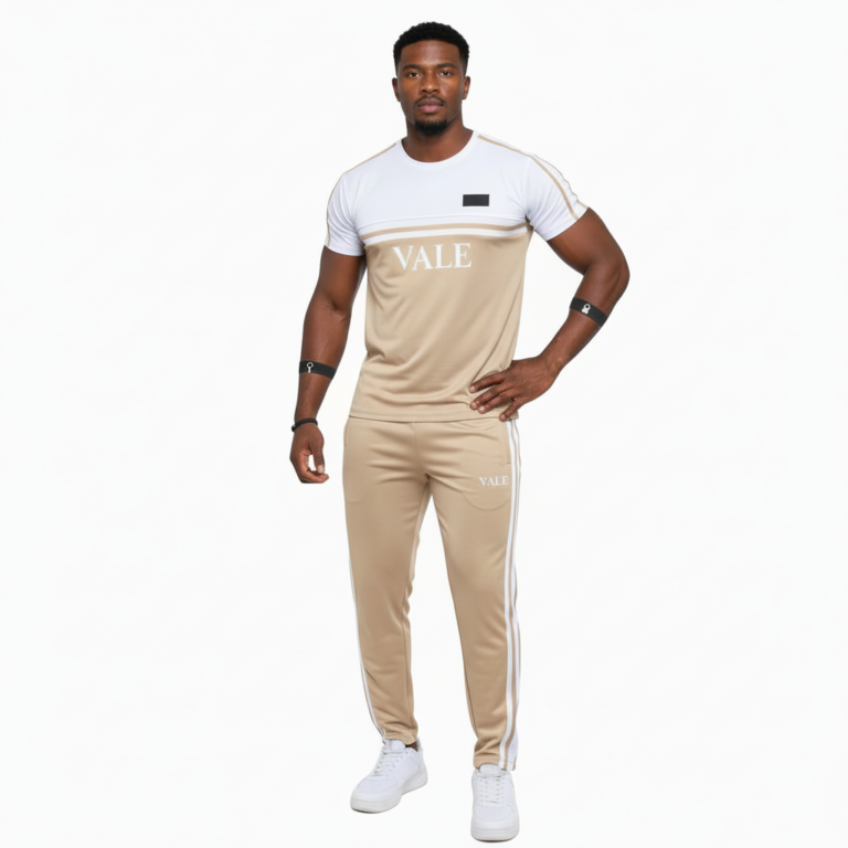 Man wearing VALE brand breathable cotton tracksuit with short-sleeve t-shirt and matching joggers in earth tones.