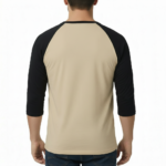 Man wearing a VALE Art Deco graphic raglan shirt made of breathable cotton with 3/4 sleeves.