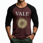 Men's 3/4 sleeve raglan baseball shirt in breathable cotton featuring a vintage VALE text and nautical compass graphic, athletic slim fit.