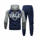 Back and front view of VALE brand breathable cotton tracksuit featuring a large shield logo, raglan sleeves, and matching joggers on a white background.