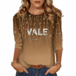 Women's breathable cotton graphic t-shirt featuring VALE floral vine print and ombre gradient design in Teal, Black, and Brown.