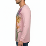 A man wearing a long-sleeved cotton shirt featuring a vertical watercolor tree design with the word "VALE" hidden in the trunk and branches.