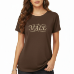 Person wearing a VALE graphic breathable cotton t-shirt in green, brown, and red colors with vintage floral design.