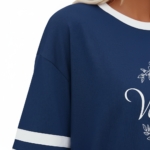 Women's oversized breathable cotton varsity t-shirt featuring a white VALE floral wreath graphic and striped sleeves, shown in Navy, Green, and Red.