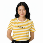 Young woman wearing a VALE brand horizontal striped breathable cotton t-shirt in blue, yellow, and green colors.