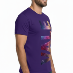 A man wearing a slim-fit 100% cotton t-shirt with a vertical 'VALE' graphic in a vibrant purple, gold, and blue metallic texture.