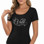 Close-up of a woman wearing a breathable ribbed cotton t-shirt featuring a glittery "Vale" graphic design with floral accents.