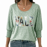 Women's breathable cotton VALE graphic top with floral lettering and smocked puff sleeves.