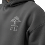 Men's 2-piece oversized tracksuit set made of breathable cotton, featuring a minimalist tree logo and VALE branding, shown in Sand Beige, Olive Green, and Charcoal Grey.