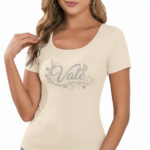 Close-up of a woman wearing a breathable ribbed cotton t-shirt featuring a glittery "Vale" graphic design with floral accents.