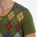 Man wearing Vale brand argyle pattern cotton t-shirt in black, blue, and green colors.