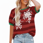 Women's breathable cotton striped t-shirt with floral rose print and green contrast trim, styled with denim jeans.