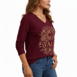 Women's long-sleeve V-neck cotton shirt featuring a gold VALE celestial sun, moon, and floral graphic design.