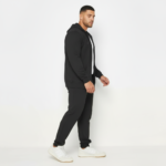Men's premium breathable cotton tracksuit featuring a full-zip hoodie and matching joggers with minimalist branding, available in Black, Green, and Blue.