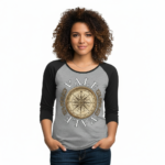 Woman wearing a breathable cotton raglan 3/4 sleeve shirt featuring a vintage nautical compass "VALE" graphic design, available in Grey/Black, White/Grey, and Olive/Black colorways.