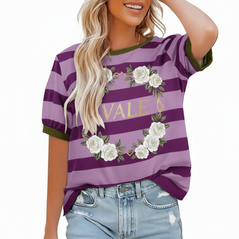 A woman wearing a breathable cotton striped t-shirt featuring a white rose wreath graphic and contrast green neckline, paired with blue denim.