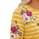 Women's breathable cotton t-shirt with VALE text, horizontal white stripes, and pink floral prints available in yellow, blue, and green.
