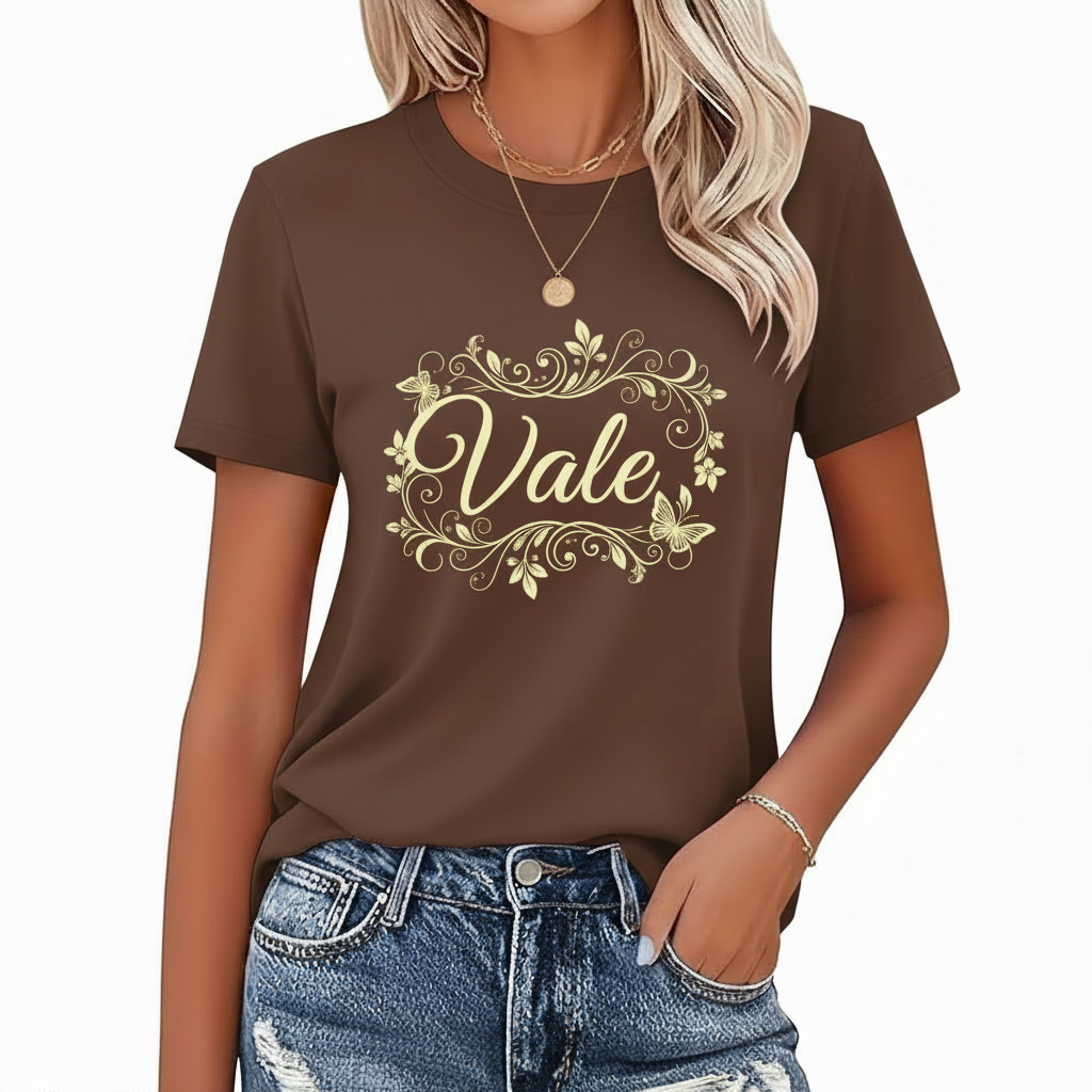 Elegant Floral "VALE" Graphic Tee Woman wearing a breathable cotton t-shirt with a floral butterfly "VALE" graphic design on the chest, available in pink, red, and brown colors.