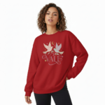 Woman wearing a VALE celestial bird graphic sweatshirt in pink, red, and cream colors. 100% breathable cotton long-sleeve shirt with moon and star design.