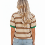 Women's breathable cotton striped t-shirt with floral rose print and green contrast trim, styled with denim jeans.