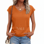 Woman wearing a VALE branded breathable cotton V-neck t-shirt in [Insert Color: Blue/Black/Orange], paired with denim jeans, showcasing a casual summer outfit.