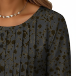 Women's breathable floral cotton blouse with VALE gold embroidery and pleated button-front design.