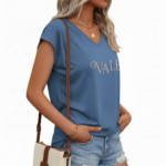 Woman wearing a breathable cotton V-neck t-shirt with "VALE" graphic print, available in Navy Blue, Slate Blue, and Olive Green.