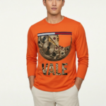 Men's long sleeve cotton shirt featuring a realistic mechanical watch gear "VALE" graphic print, available in orange, charcoal, and olive green.
