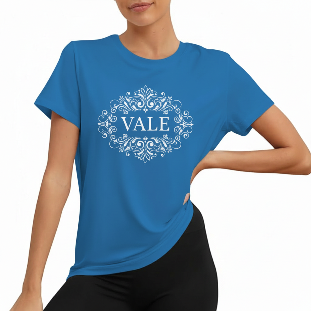 VALE Signature Filigree Graphic T-Shirt Women wearing VALE brand cotton graphic t-shirt with white filigree mandala design, available in blue, mustard, and cream.
