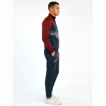 Men's breathable cotton tracksuit featuring a forest silhouette and key graphic print, available in green, orange, and maroon color blocks.