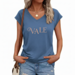 Woman wearing a breathable cotton V-neck t-shirt with "VALE" graphic print, available in Navy Blue, Slate Blue, and Olive Green.