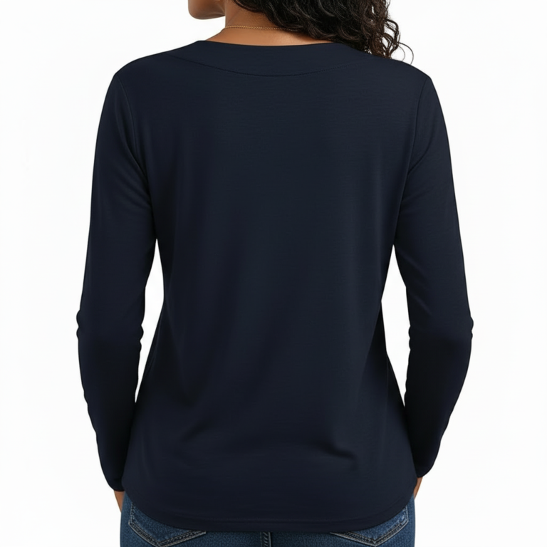 Close-up of a woman wearing a VALE brand long-sleeve V-neck cotton shirt featuring a gold celestial floral graphic design, available in black, navy, and burgundy.