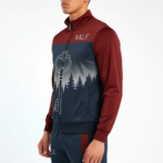 Men's breathable cotton tracksuit featuring a forest silhouette and key graphic print, available in green, orange, and maroon color blocks.