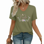 A woman wearing a breathable cotton V-neck t-shirt with a floral "Vale" graphic design, available in orange, khaki, and olive green colors.