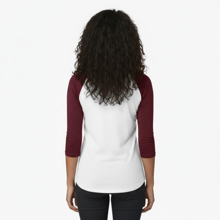 Woman wearing a VALE branded 3/4 sleeve raglan cotton shirt with metallic copper logo, athletic slim fit baseball style.
