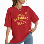 Woman wearing a breathable cotton oversized t-shirt with "Sunshine and Beach" yellow graphic print, available in navy blue, maroon, and red.