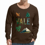 A man wearing a long-sleeve cotton shirt with a "VALE" nature graphic featuring a mountain, eagle, and tree, available in cream, black, and chocolate brown.