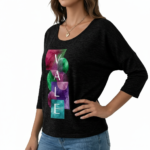 Front view of a woman wearing a breathable cotton 3/4 sleeve shirt with a "VALE" artistic watercolor geometric graphic design, available in maroon, black, and blue.