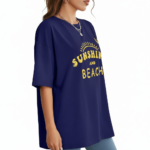 Woman wearing a breathable cotton oversized t-shirt with "Sunshine and Beach" yellow graphic print, available in navy blue, maroon, and red.