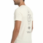 Back view of a man wearing a VALE brand 100% cotton breathable T-shirt featuring a black geometric compass and celestial line-art design.