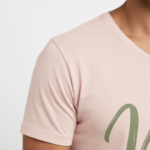 Man wearing a breathable 100% cotton Vale signature scoop neck t-shirt in navy, pink, and burgundy colors, athletic slim fit.