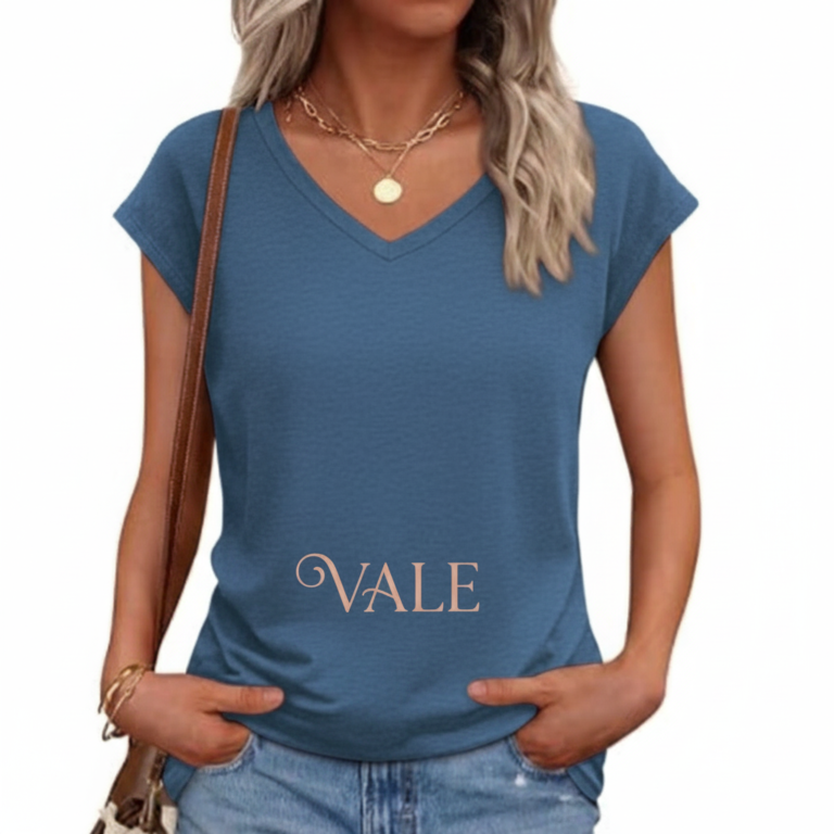 Woman wearing a VALE branded breathable cotton V-neck t-shirt in [Insert Color: Blue/Black/Orange], paired with denim jeans, showcasing a casual summer outfit.