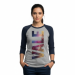 Person wearing a 3/4 sleeve raglan cotton shirt featuring a vertical VALE galaxy-textured graphic print.