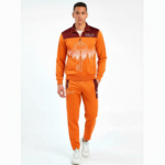 Men's breathable cotton tracksuit featuring a forest silhouette and key graphic print, available in green, orange, and maroon color blocks.