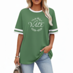 Women's oversized breathable cotton varsity t-shirt featuring a white VALE floral wreath graphic and striped sleeves, shown in Navy, Green, and Red.
