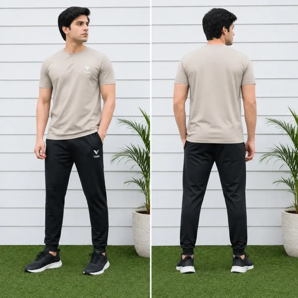 Men wearing beige t-shirt with black track pants sportswear outfit standing outdoors