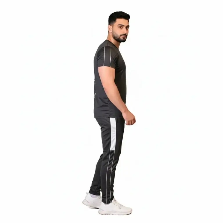 Front and back view of a man wearing the VALE brand breathable cotton performance tracksuit, featuring a vertical outline logo on the t-shirt back and matching side-striped joggers on a white background.